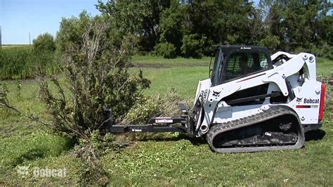 bobcat skid steer tree saw|tree cutting attachment for bobcat.